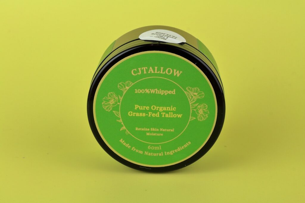 60ml jar of 100% pure organic grass-fed tallow skin moisturizer. Dark olive green packaging. Made with natural ingredients to help retain skin's natural moisture.