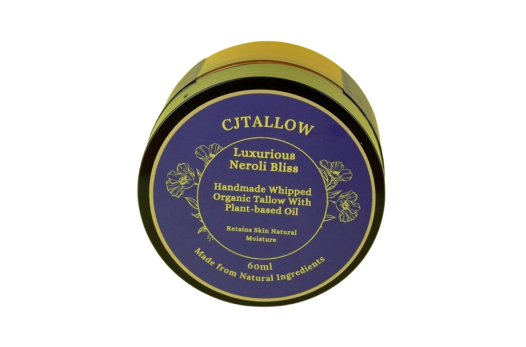 60ml jar of Neroli-scented whipped organic pasture-raised British tallow by CJTALLOW, blended with plant-based oils for natural skin hydration and nourishment. In Navy blue packaging. Made with natural ingredients to help retain skin's natural moisture.