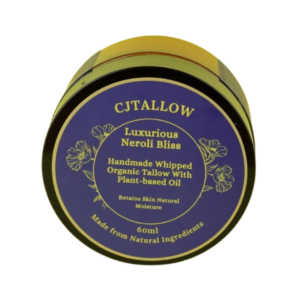 60ml jar of Neroli-scented whipped organic pasture-raised British tallow by CJTALLOW, blended with plant-based oils for natural skin hydration and nourishment. In Navy blue packaging. Made with natural ingredients to help retain skin's natural moisture.