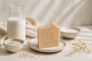 CJTallow Tallow Goat's Milk & Oats Soap with goat's milk and oats in a minimalist natural setting, highlighting a handcrafted cleansing bar made with grass-fed tallow.