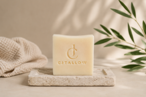 CJTallow Pure Tallow Soap displayed in a minimalist setting on a stone soap dish, handcrafted with certified organic British grass-fed beef tallow.